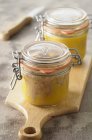 Closeup view of goose liver in preserving jars — Stock Photo