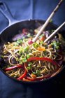 Fried noodles with duck in pan — Stock Photo
