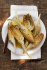 Marinated artichokes with fork — Stock Photo