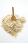 Wholemeal flour with scoop — Stock Photo