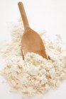 Flour with wooden scoop — Stock Photo