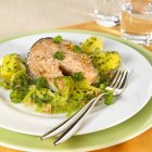 Salmon cutlet with parsley potatoes — Stock Photo