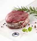 Piece of beef sirloin with herbs and spices — Stock Photo