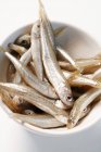 Sandsmelts in small white bowl — Stock Photo