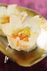 Closeup view of filled Wontons with trout caviar and quail egg — Stock Photo