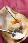 Closeup view of filled Wonton with trout caviar and fried quail egg — Stock Photo