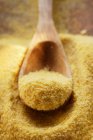 Closeup view of Polenta with wooden spoon — Stock Photo