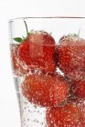 Glass of sparkling strawberry punch — Stock Photo