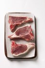 Lamb cutlets on paper — Stock Photo
