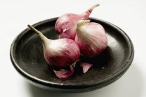 Three red onions — Stock Photo