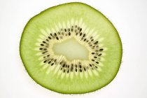Slice of kiwi fruit — Stock Photo