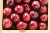 Cranberries in wooden box — Stock Photo