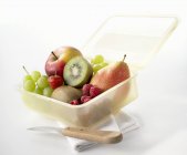Lunch box with fresh fruits — Stock Photo