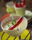 Chili pepper on fondue stick — Stock Photo