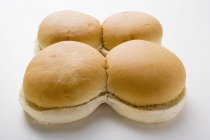 Четыре булочки с гамбургерами — стоковое фото