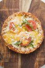 Mini pizza with tomato and cheese — Stock Photo