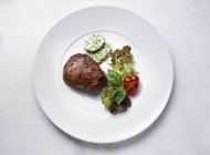 Fillet steak with herb butter and salad — Stock Photo