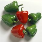 Red and green bell peppers — Stock Photo