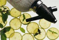 Lime Slices with Mint Leaves and siphon — Stock Photo