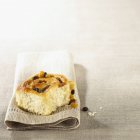 Coiled yeast bun with raisins — Stock Photo
