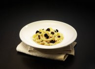 Tagliatelle pasta with black truffles — Stock Photo