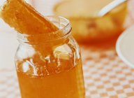 Honeycomb in glass jar — Stock Photo