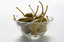 Giant capers in glass bowl — Stock Photo