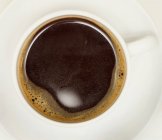 Cup of freshly-made black coffee — Stock Photo