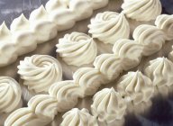 Closeup view of white cream decorations — Stock Photo