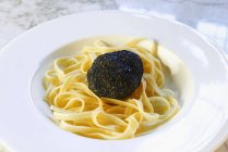 Tagliatelle pasta with black truffle — Stock Photo