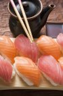 Nigiri sushi with chopsticks — Stock Photo