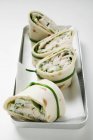 Closeup view of four wraps with fish filling — Stock Photo