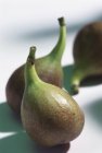 Three green figs — Stock Photo