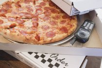 Pepperoni pizza in pizza box — Stock Photo