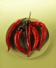 Five red chillies — Stock Photo