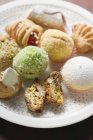 Closeup view of different pastries on white plate — Stock Photo