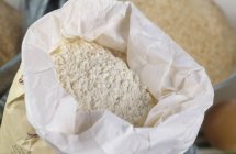 Flour in paper bag — Stock Photo