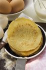 Pancakes in frying pan — Stock Photo