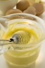 Closeup view of Hollandaise sauce in small glass pan — Stock Photo