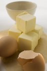 Butter, egg and eggshells — Stock Photo