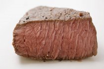 Beef steak with a piece cut off — Stock Photo