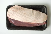 Duck breast in polystyrene tray — Stock Photo