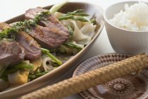 Duck breast with rice noodles — Stock Photo