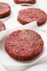 Raw beef burgers — Stock Photo
