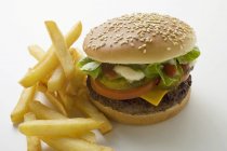 Cheeseburger and Potato Fries — Stock Photo