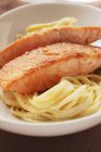 Fried salmon fillets and spaghetti — Stock Photo