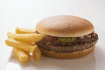 Hamburger with french potato fries — Stock Photo