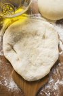 Closeup top view of raw dough with oil — Stock Photo