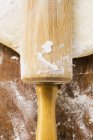 Dough with rolling pin — Stock Photo