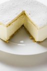 Cream cheesecake with powdered sugar — Stock Photo